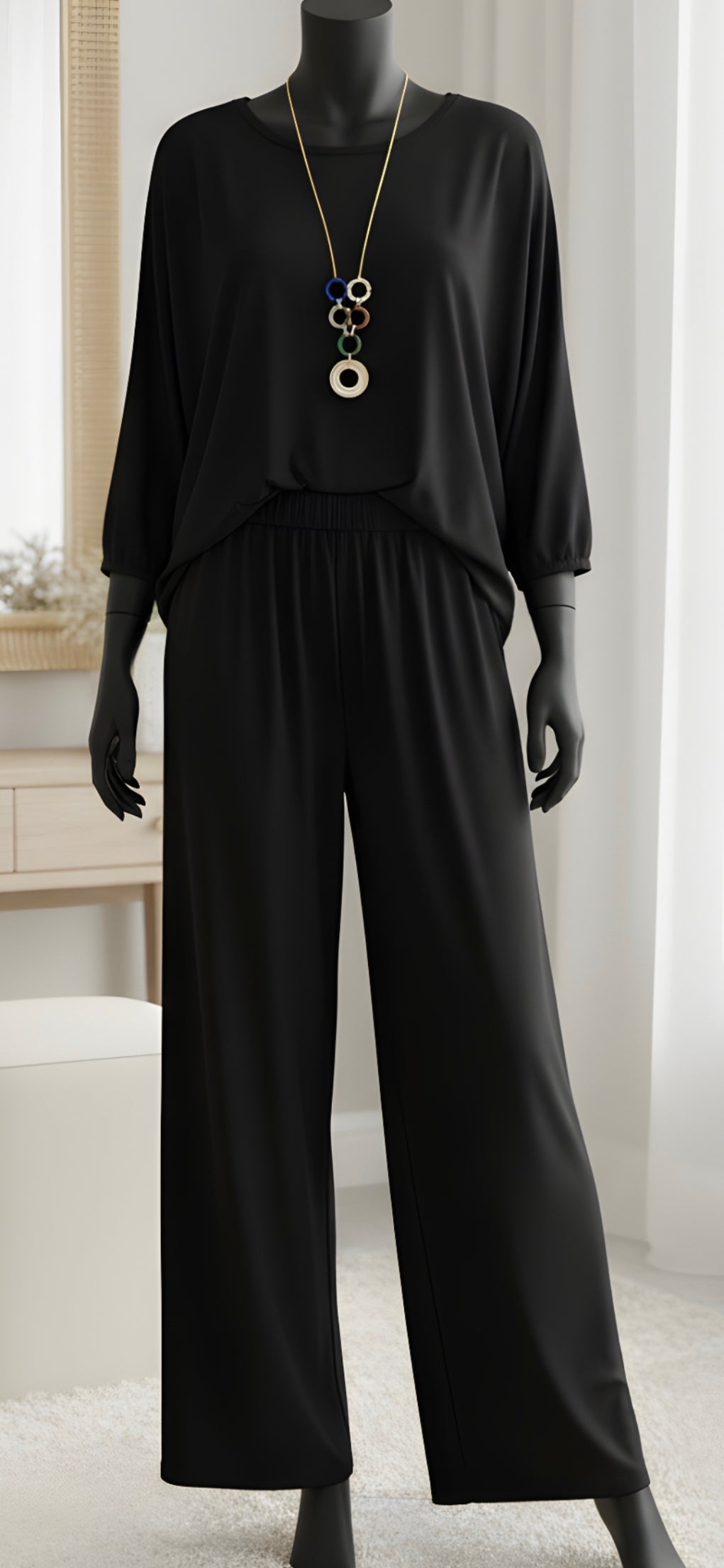 "Plus size two-piece set with pendant detail - complete outfit"