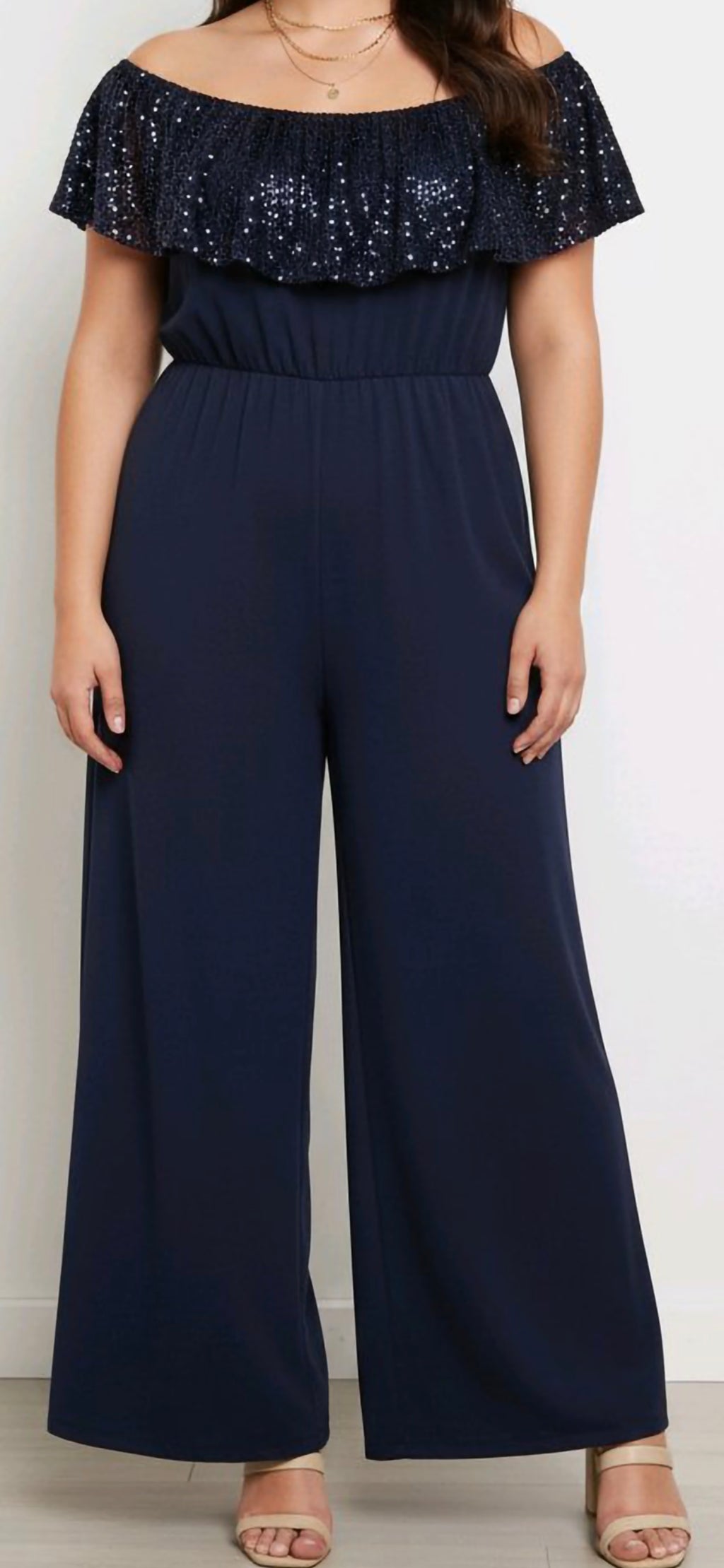 off-the-shoulder wide-leg jumpsuit with a sequin frill top and smocked waist